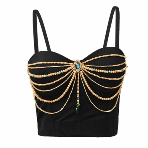 Top corto negro con cadenas doradas decorativas.