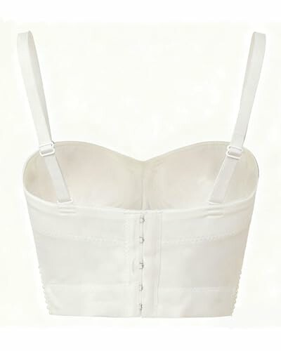 Vista trasera de un bustier blanco con tirantes ajustables.